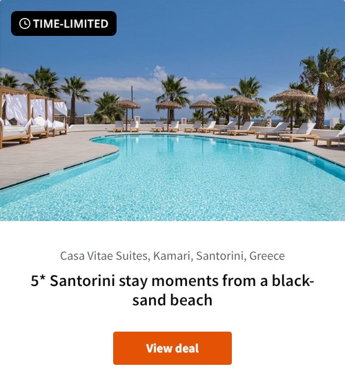 5* Santorini stay moments from a black-sand beach